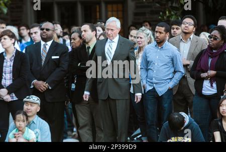 Duke President Richard Brodhead, center, listens to speakers during a university-wide forum outside the Duke Chapel on campus Wednesday, April 1, 2015, in Durham, N.C. Duke officials said Wednesday that they are trying to find out who hung a noose outside a building that houses several offices, including those focused on diversity. (AP Photo/The News & Observer, Travis Long) MANDATORY CREDIT