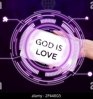 Scrittura del testo Dio è amore. Concetto di Internet credere in Gesù avere fede pensieri religiosi Cristianesimo Foto Stock