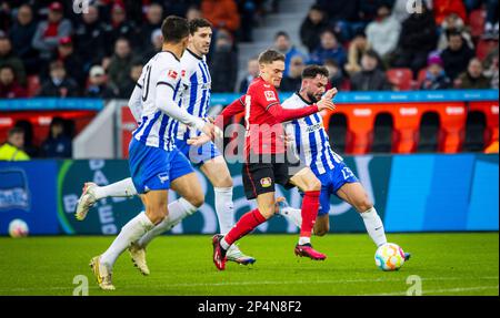 Leverkusen, Germania. 5th Mar, 2023. Florian Wirtz (Leverkusen), Marco Richter (Hertha), Agustin Rogel (Hertha) Bayer Leverkusen - Hertha BSC Berlin B. Foto Stock