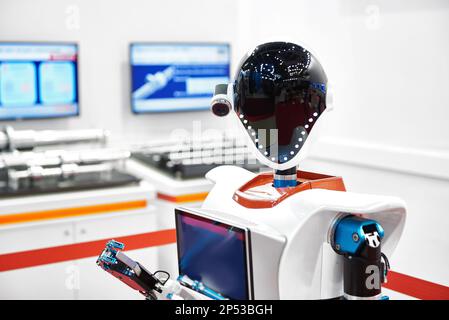 Robot Android a lavorare alla mostra Foto Stock