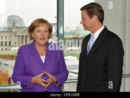 Angela Merkel, German Chancellor and leader of the conservative Christian Democratic Union party (CDU), left, and Guido Westerwelle, leader of the pro-business Free Democrats (FDP) meet at the Chancellery in Berlin Monday Sept. 28, 2009. Merkel's conservatives vowed on Monday to seal a coalition deal with the Free Democrats (FDP) within a month after winning Germany's election (Bundestagswahl). (AP Photo/Wolfgang Rattay,Pool)