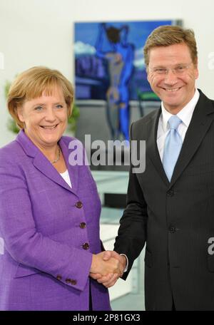 Angela Merkel, German Chancellor and leader of the conservative Christian Democratic Union party (CDU), left, and Guido Westerwelle, leader of the pro-business Free Democrats (FDP) meet at the Chancellery in Berlin, Monday, Sept. 28, 2009. Merkel's conservatives vowed on Monday to seal a coalition deal with the Free Democrats (FDP) within a month after winning Germany's election. (AP Photo/Wolfgang Rattay,Pool)