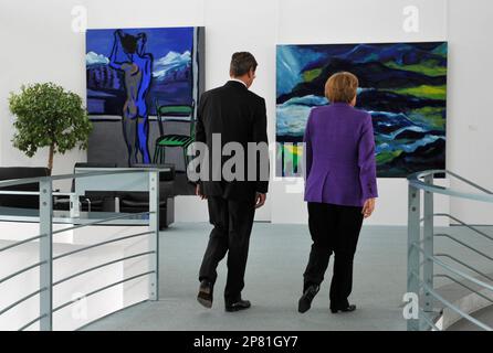 Angela Merkel, German Chancellor and leader of the conservative Christian Democratic Union party (CDU),right, and Guido Westerwelle, leader of the pro-business Free Democrats (FDP) meet at the Chancellery in Berlin Monday Sept. 28, 2009. Merkel's conservatives vowed on Monday to seal a coalition deal with the Free Democrats (FDP) within a month after winning Germany's election (Bundestagswahl). (AP Photo/Wolfgang Rattay,Pool)