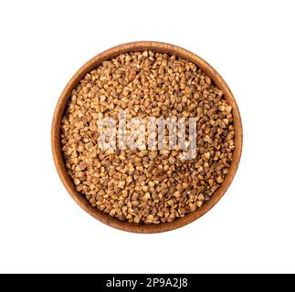 Mattone crudo di grano saraceno isolato, grani di grano saraceno secco buck, Russian Kasha Heap, grano saraceno crudo ritagliato su sfondo bianco Vista dall'alto Foto Stock