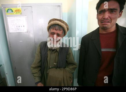 Relatives of wounded civilian cry in a hospital in Kabul, Afghanistan, Thursday, Nov. 27, 2008. Afghan police said a suicide car bomb has exploded about 200 yards (meters) outside the main entrance to the U.S. Embassy in Kabul in an attack against an American convoy. (AP Photo/Rafiq Maqbool)