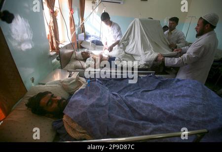 Wounded Afghans receive treatments in a hospital in Kabul, Afghanistan, Thursday, Nov. 27, 2008. Afghan police said a suicide car bomb has exploded about 200 yards (meters) outside the main entrance to the U.S. Embassy in Kabul in an attack against an American convoy. (AP Photo/Rafiq Maqbool)