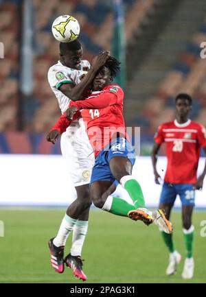 Cairo, Egitto. 11th Mar, 2023. Muhamed Sawaneh (R) di Gambia vies per un header durante la finale tra Senegal e Gambia alla 2023 CAF (Confederation of African Football) U-20 Africa Cup of Nations partita di calcio al Cairo, Egitto, 11 marzo 2023. Credit: Ahmed Gomaa/Xinhua/Alamy Live News Foto Stock