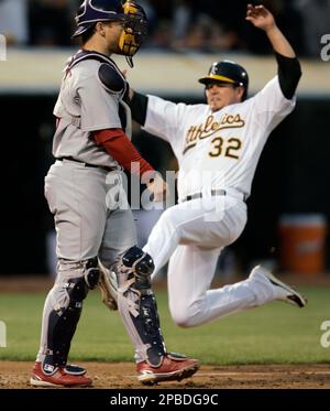 Oakland Athletics' Jack Cust, right, gets a handshake from third base coach  Tony DeFrancesco after Cust hit a two-run home run off Texas Rangers' Eric  Hurley in the first inning of a