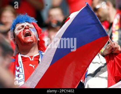 A fan of the Czech Republic's national soccer team cheers as he waits for the start of the Germany 2006 Soccer World Cup, Group E, soccer match between Czech Republic and Ghana at Cologne's stadium, Germany, Saturday, June 17, 2006. The other teams in Group E are Italy and the United States. (AP Photo/Petr David Josek) ** MOBILE/PDA USAGE OUT **