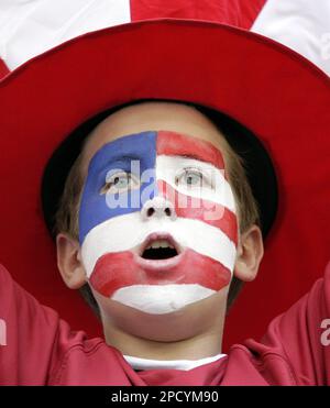A young fan of the USA national soccer team chants as he waits for the start of the World Cup, Group E soccer match between the United States and the Czech Republic, at the Gelsenkirchen stadium, Germany, Monday, June 12, 2006. The other teams in Group E are Italy and Ghana. (AP Photo/Michael Sohn) MOBILE/PDA USAGE OUT