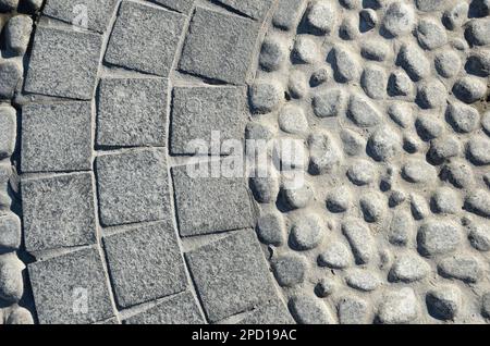 Passerella in pietra pavimentata con pietra e granito, rotonda e quadrata Foto Stock