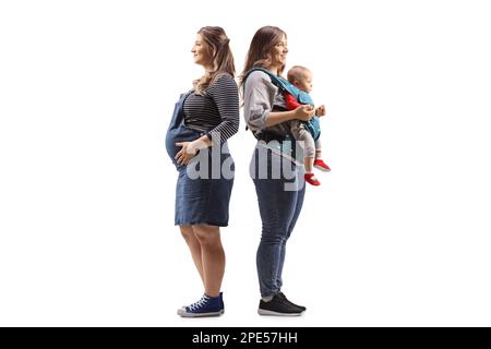 Profilo a lunghezza intera di una donna incinta immaginando se stessa con un bambino isolato su sfondo bianco Foto Stock