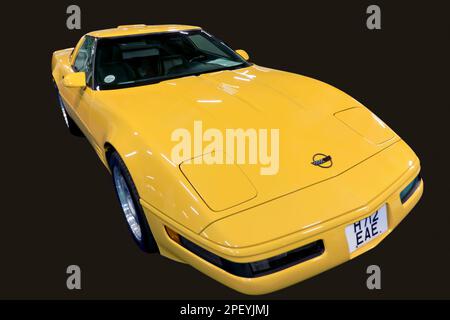 Cut-out of a Yellow, 1991, Chevrolet Corvette C4, in mostra al London Classic Car Show 2023 Foto Stock