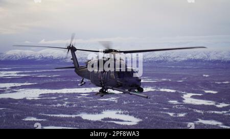 Alaska, Stati Uniti. 7th Feb, 2023. Alaska Air National Guardsmen con lo Squadrone di salvataggio 210th manovrare un falco di nave HH-60G sopra la valle inferiore di Susitna vicino ad Anchorage, Alaska, 7 febbraio 2023. L'HH-60G, il 211th RQS HC-130J Combat King II e il personale di soccorso del 212th RQS si allerta per la missione federale di ricerca e salvataggio nella regione artica dell'Alaska. (Foto della Guardia Nazionale dell'Alaska di Dana Rosso) Credit: US Air Force/ZUMA Press Wire Service/ZUMAPRESS.com/Alamy Live News Foto Stock