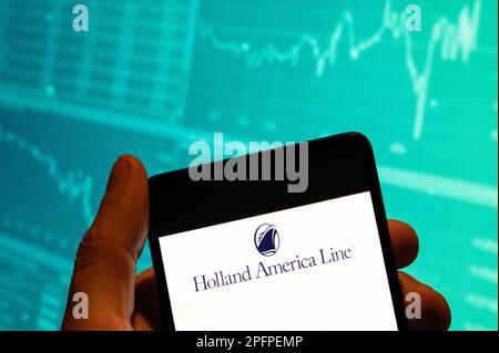 Cina. 15th Feb, 2023. In questa foto, il logo Holland America Line della compagnia di crociere viene visualizzato su uno smartphone con un grafico dell'indice di borsa economica sullo sfondo. (Credit Image: © Budrul Chukrut/SOPA Images via ZUMA Press Wire) SOLO PER USO EDITORIALE! Non per USO commerciale! Foto Stock