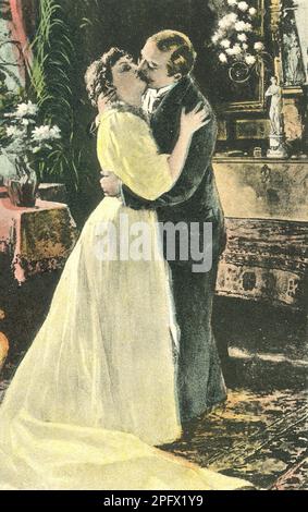 Baciare. Una coppia che abbraccia e bacia questa foto colorata risalente agli inizi del 20th ° secolo. Foto Stock