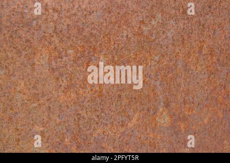 Struttura metallica arrugginita, ruggine e fondo metallico ossidato. Vecchio pannello in ferro metallico. Concetto grunge. Toni arancioni. Foto Stock