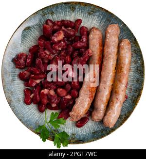 Salsicce con fagioli rossi, tipico piatto catalano burifarra con alubias Foto Stock