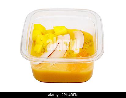 Frullati con frutta fresca e noci. Ciotola di frullato, mango, frutto della passione, cocco. Salsa di mele, scorza di limone. Foto di alta qualità. Foto Stock