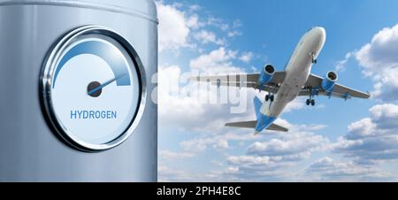 Serbatoio con indicatore con iscrizione idrogeno su uno sfondo di aeroplano e cielo blu. Concetto di mobilità pulita Foto Stock