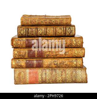 Pila di libri antichi con copertina in pelle e ornamenti dorati su sfondo bianco isolato Foto Stock