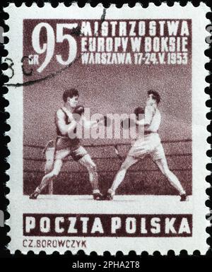 Pugili durante una partita su vintage polacco francobollo Foto Stock