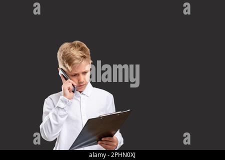 bambini business smart boy lavoro telefono progetto Foto Stock