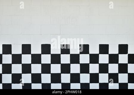 Muro di cenere a scacchi in bianco e nero Foto Stock