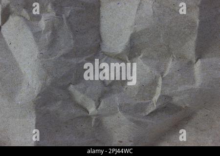 Texture di fondo di carta kraft. Un foglio di carta da imballaggio stropicciato Foto Stock