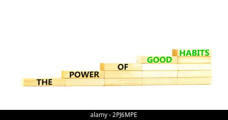 Il potere di buone abitudini simbolo. Concetto di parole il potere di buone abitudini su blocco di legno. Bellissimo sfondo bianco tavolo. Business la potenza di Foto Stock