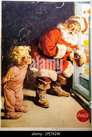 Annuncio natalizio Coca-Cola 1949. Babbo Natale apre un frigorifero per un bambino Foto Stock