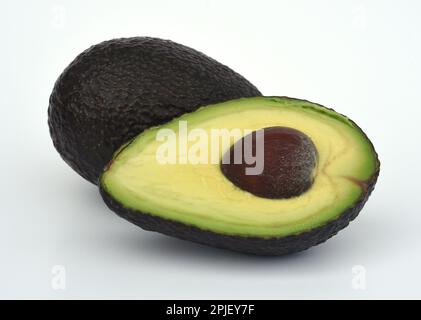 Avocados, Persea, americana, sind Suedfruechte, und als Frucht botanisch gesehen Beeren, Avocados, Persea, americana, sono frutti del sud, e botanica Foto Stock