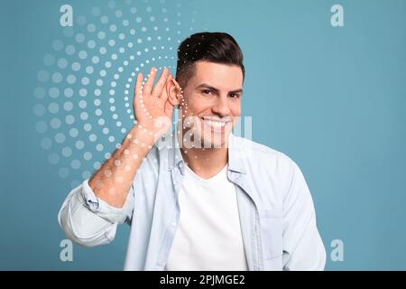 Bell'uomo e illustrazione del suono su sfondo azzurro. Concetto di udito Foto Stock