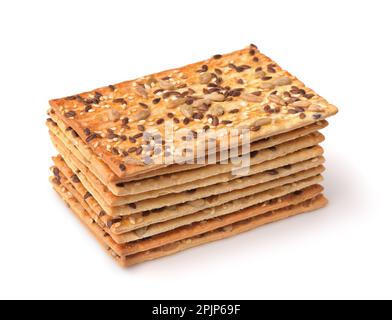 Impila di pane croccante intero di grano con i vari semi isolati su bianco Foto Stock