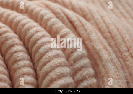 Bello tessuto a maglia rosa pallido come sfondo, primo piano Foto Stock