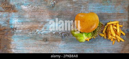 Veggie hamburger e patatine fritte. Foto Stock