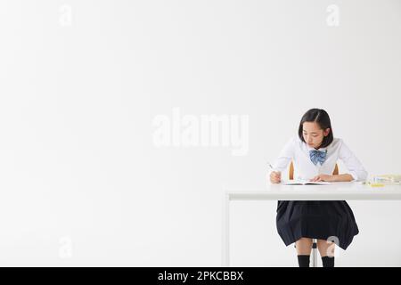 High School girl studiare Foto Stock