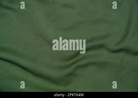 Tessuto astratto, sfondo verde stropicciato Foto Stock