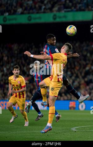 Barcellona, Spagna. 10th Apr, 2023. L'Ansu dati di Barcellona (TOP, L) è in testa alla partita di calcio spagnola la Liga tra il FC Barcelona e il Girona FC a Barcellona, in Spagna, il 10 aprile 2023. Credit: Joan Gosa/Xinhua/Alamy Live News Foto Stock