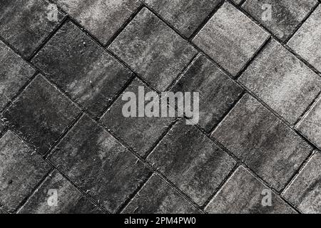 Fondo stradale in cemento grigio scuro, pavimentazione in lastre Foto Stock