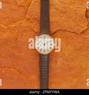 Orologio da polso di lusso isolato su uno sfondo di pietra. Foto Stock