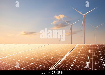 Pannelli solari e turbine eoliche elettriche al tramonto. Energia rinnovabile, pulita e sostenibile per le imprese e la vita. Foto Stock