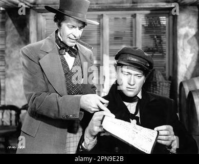 RAYMOND MASSEY e JOHN WAYNE in REAP THE WILD WIND 1942 regista CECIL B. DeMILLE basato su Sabato sera Post storia di Thelma Strabel sceneggiatura Alan le May Charles Bennett e Jesse Lasky Jr. Musica Victor Young costume design Natalie Visart Paramount Pictures Foto Stock