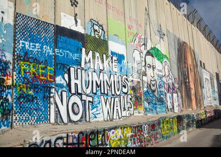 Fare Hummus non pareti opere d'arte sul muro a Betlemme, Palestina Foto Stock