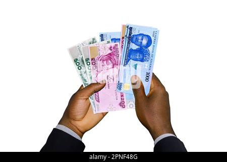 Le mani nere in tuta che reggono 3D hanno reso note di New Nigerian Naira Foto Stock