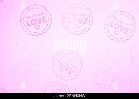realizzato con amore, stampa rotonda in colore rosa. sfondo in tonalità rosa. Foto Stock