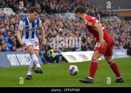 Hartlepool, Regno Unito. 22nd aprile 2023.Connor Jennings di Hartlepool United cerca di battere Nicholas Tsaroulla di Crawley Town durante la partita della Sky Bet League 2 tra Hartlepool United e Crawley Town a Victoria Park, Hartlepool sabato 22nd aprile 2023. (Foto: Scott Llewellyn | NOTIZIE MI) Credit: NOTIZIE MI & Sport /Alamy Live News Foto Stock