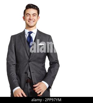 Testa dritta per la parte superiore. Un bel giovane in un vestito a tre pezzi che si erge su uno sfondo bianco. Foto Stock