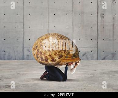 Scared businessman acts like a slow snail Foto Stock