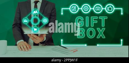Didascalia di testo che presenta la confezione regalo. Idea aziendale Un piccolo cointainer con disegni in grado di gestire i regali Foto Stock